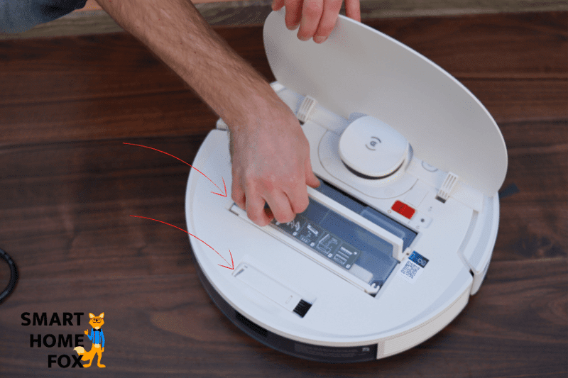 A close-up of the cleaning tool and the dust container of the Ecovacs Deebot N8.